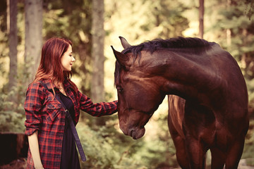 Redhead girl with horse