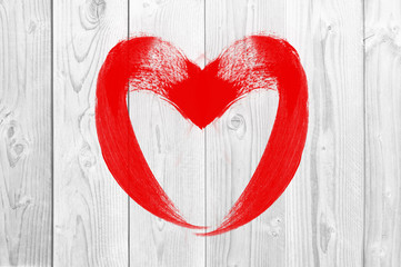 drawing heart love symbol on white wooden wall