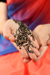Image of henna on female hand, closeup
