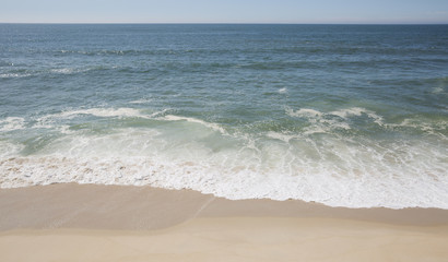 Fototapeta na wymiar Wave of the sea on the sand beach 