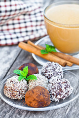 Assorted dark chocolate truffles with cocoa powder and sesame se