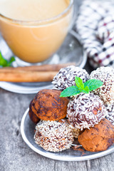 Assorted dark chocolate truffles with cocoa powder and sesame se