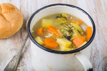Fresh cucumber soup in a cup on a white table