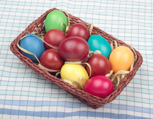 Basket with colorful easter eggs