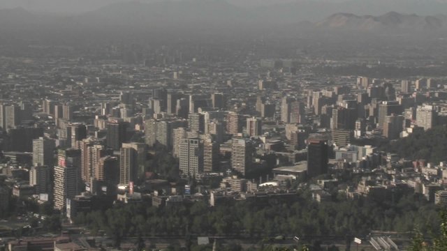 Pan across the smog filled city of Santiago, Chile.