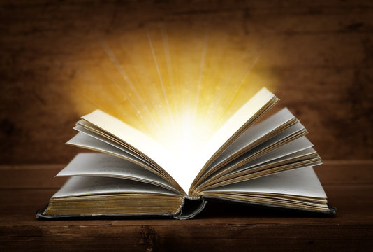 open book with magic light.
