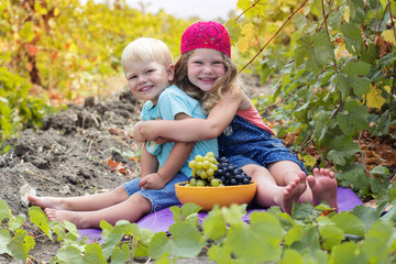 Cute little girl and her brother outdoor 