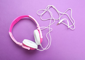 Headphones on purple background