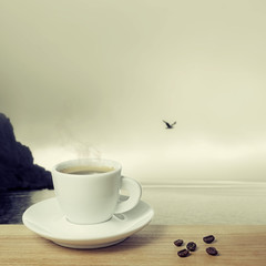 .Cup of coffee on a background seascape
