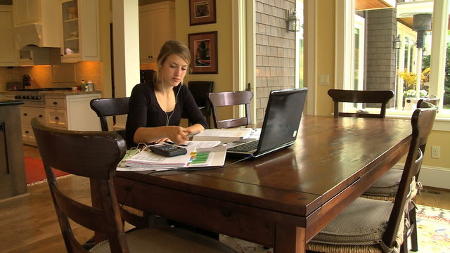 MWS student adjusts Ipod while studying