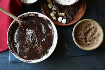 Preparing dough for chocolate pie on table close up