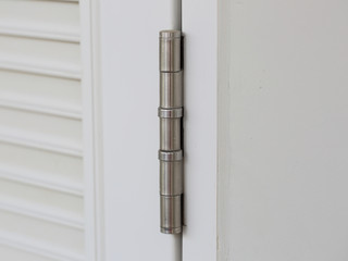 stainless door hinges on white door