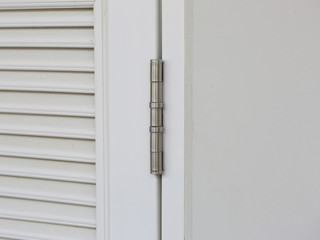 stainless door hinges on white door