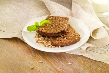 Bread slices with seeds on white dish