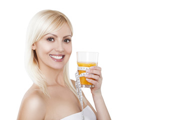 Young woman with glass of orange juice. Female model happy smile
