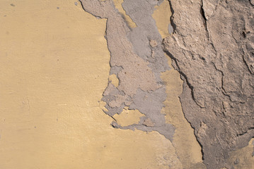 old chipped plaster on the concrete wall texture background