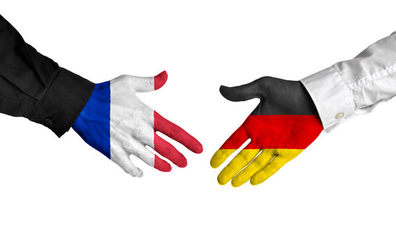 France and Germany leaders shaking hands on a deal agreement