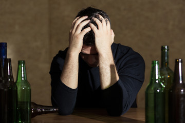 Young man addicted to alcohol