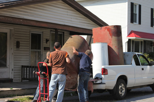 Men Loading Truck Hauling Scrap To Recycling Yard