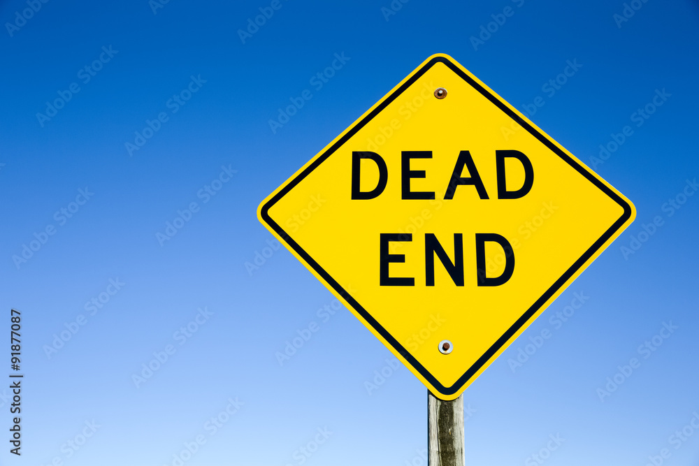 Wall mural dead end sign against blue sky