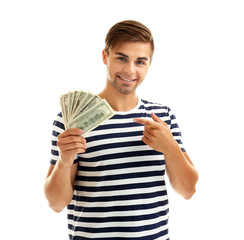 Handsome young man holding money isolated on white