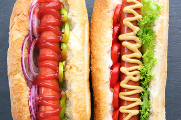 Fresh hot dog on dark grey background closeup