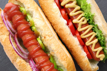 Fresh hot dog on dark grey background closeup