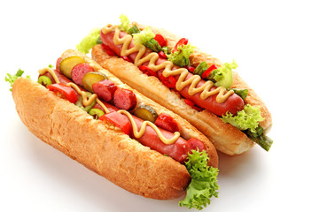 A pair of fresh hot dogs isolated on white