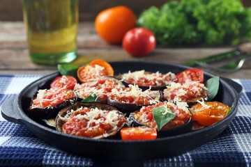 Baked vegetables in pan on table, close-up