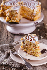  Traditional Hungarian Esterhazy cake .selective focus .Esterhazy cake with chocolate piece with a name of the cake: 