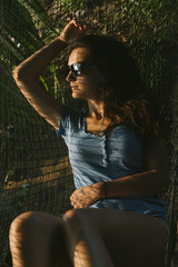Obraz premium Beautiful woman lying in hammock.