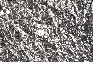 Silver wrinkled and shrunken foil surface, crinkly, crushed metallic background