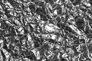 Silver wrinkled and shrunken foil surface, crinkly, crushed metallic background