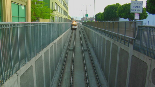 A subway moves above ground.