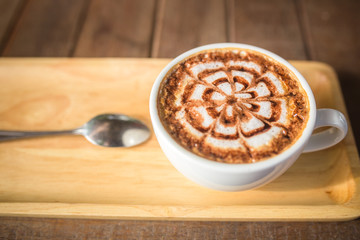 Latte Coffee art on the wooden desk