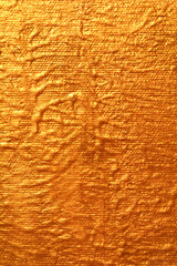 Gold textured surface, golden background.