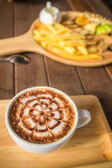Latte Coffee art on the wooden desk