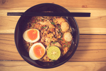 Thai noodle soup in a bowl taste spicy noodle soup and boiled eg
