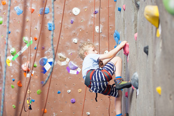boy rock climbing