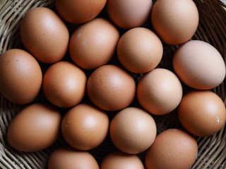basket eggs on vintage wooden background