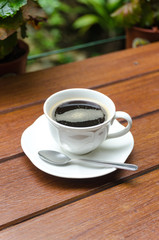 Cup of coffee on wood table