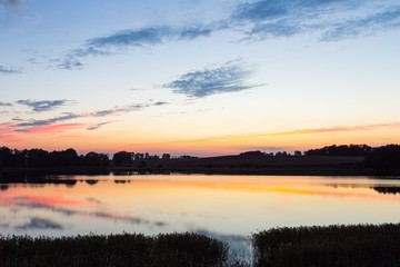 Fototapeta na wymiar Beautiful lake landscape after sunset