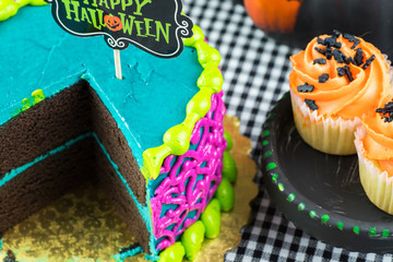 Halloween butter cream cake and cupcakes.