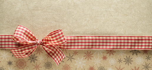 Ribbon bow on golden background