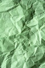 Green crumpled paper for background. Textured grunge surface for design.