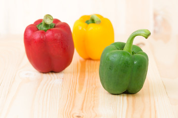 Green sweet peper on wooden background