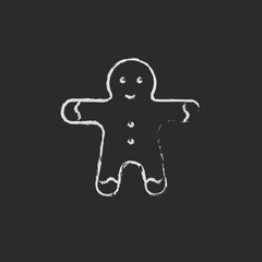 Gingerbread man icon drawn in chalk.