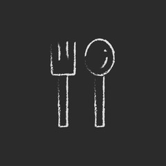 Spoon and fork icon drawn in chalk.