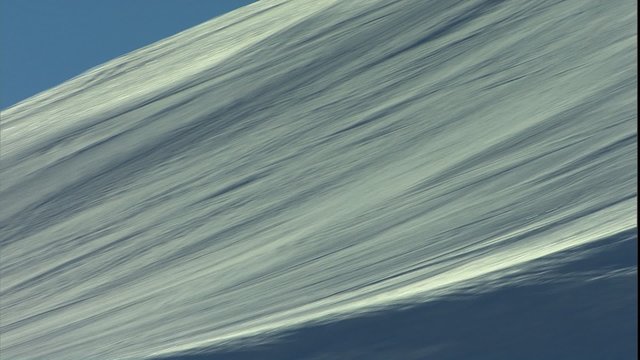 Skier with 520 spin over freestyle jump