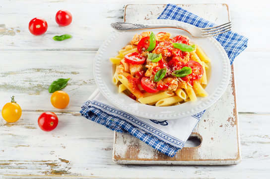 Pasta with Chicken, tomato Sauce and herbs.